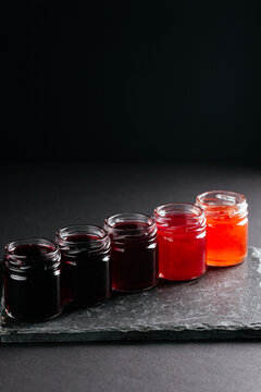 berry tinctures in shorts on black background