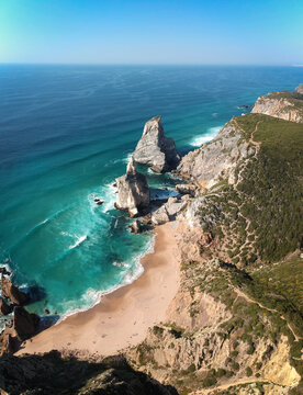 Aerial view from a sandy wild beach with amazing rocks. Ursa Beac