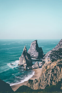 Aerial view from a sandy wild beach with amazing rocks. Ursa Beac