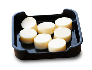 Obraz na płótnie Canvas fresh raw tofu sliced on square plate isolated on white background, shabu, hot pot ingredients