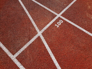 Red treadmill with white lines in a sports stadium. Red running tracks in the stadium. Empty sport stadium. 