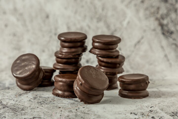 Homemade chocolate alfajores, typical of Argentina, marble background with copy space