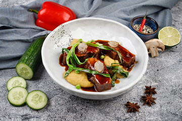 pork in sauce with potatoes,onions, green peas