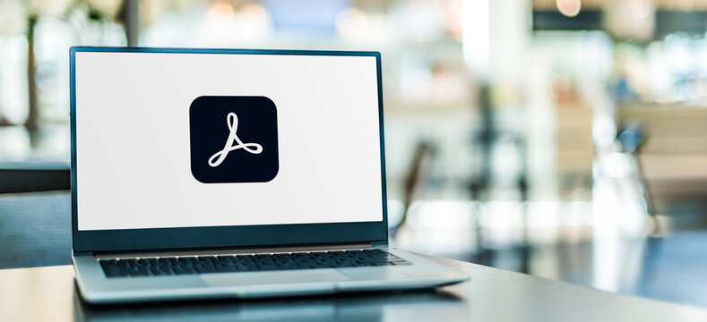 Laptop computer displaying logo of Adobe Acrobat