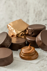Homemade chocolate alfajores, typical of Argentina, marble background with copy space