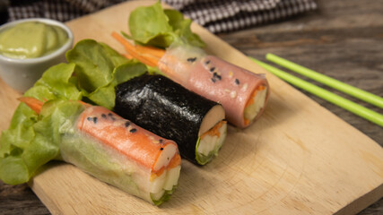 salad roll on wood plate