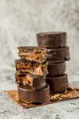 Homemade chocolate alfajores, typical of Argentina, marble background with copy space
