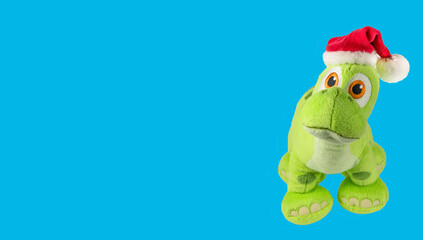 Soft toy dragon isolated on blue background. Kids toys.