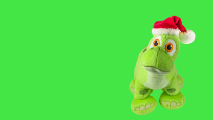 Soft toy dragon isolated on green background. Kids toys.