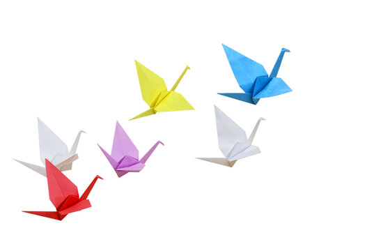 Origami birds flying on white