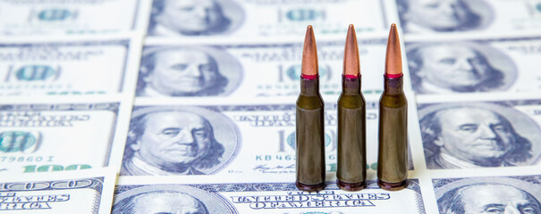 The bloody business of war. Bullets on US Dollar bills