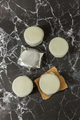 Homemade chocolate alfajores, typical of Argentina, marble background with copy space