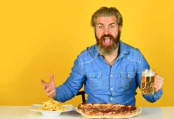 Pizza party concept. Big portion. Friday tradition. Dinner at pub. Hungry man going to eat pizza and drink beer. Finally pizza time. Pizzeria restaurant. Cheerful man bearded hipster eat pizza