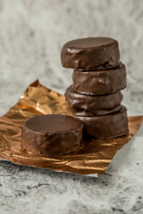 Homemade chocolate alfajores, typical of Argentina, marble background with copy space