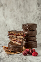 Homemade chocolate alfajores, typical of Argentina, marble background with copy space