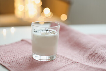 Organic scented soy candle in glass on the table. minimalism concept. Close up, copy space for text 