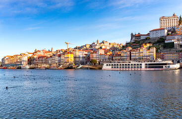 Fototapeta na wymiar Porto. Multicolored houses on the waterfront of the Douro River.