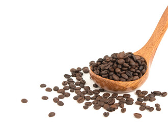 Coffee beans are strewed in a spoon wood for coffee on a white background