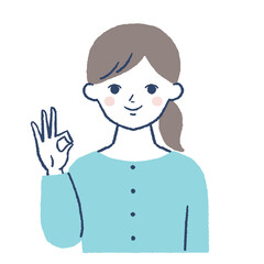 笑顔でOKポーズをする女性