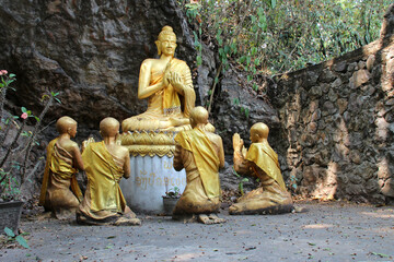 statues of buddha and buddhist monks at mount phousi in luang prabang (laos) - obrazy, fototapety, plakaty