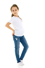 Fototapeta premium Girl in Blank White Shirt and Blue Jeans Standing Half Turn