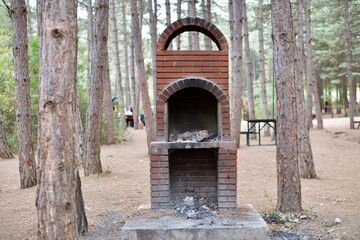 BBQ or barbecue place made of tiles in the forest