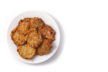 Traditional Jewish latkes or potato pancakes isolated on white background.Top view. Copy space