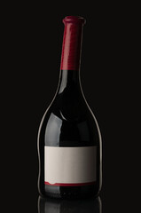 Wine bottle closeup on black background