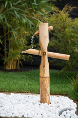Closeup of zen bamboo fountain in a japanese garden
