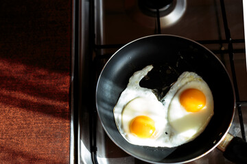 making english breakfast. cooking scrambled eggs.