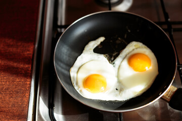 making english breakfast. cooking scrambled eggs.