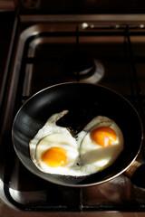 making english breakfast. cooking scrambled eggs.