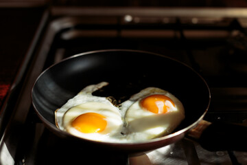 making english breakfast. cooking scrambled eggs.