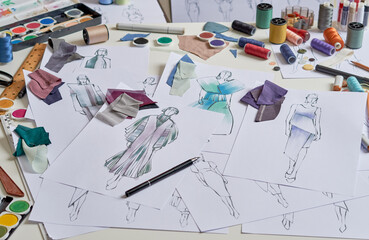 Fashion designer stylish drawings sketches textile fabric material Costume. Designer creative workshop studio.