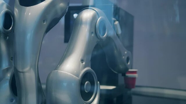 Ai, future science, technology concept. Robotic barista serving a cup of coffee