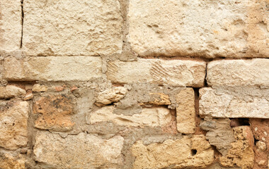 Stones in the wall of the house as an abstract background.