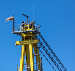 Details of the crane against the blue sky.