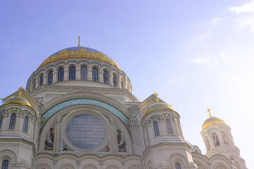 Kronshtadt, Saint Petersburg, Russia,09.08.2020. The Cathedral of St. Nicholas the Wonderworker. Blue sky, clouds and sunny weather. important religious site.