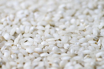 White rice seed texture as background. Perspective