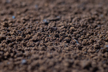 Pile of powdered, instant coffee as background. Perspective