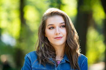 Fototapeta premium Beauty portrait of female face with natural skin. Beauty portrait of female face. Gorgeous young model woman posing in the city. Wonderful white female. Stylish. Hipster. Russian.