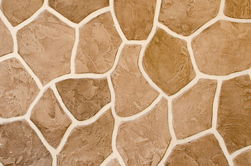 Decorative stucco wall of the house.