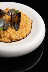 Risotto with mussels and rice in a white plate. Spanish cuisine, Seafood Paella