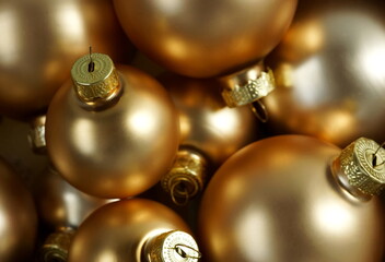 Fototapeta na wymiar golden Christmas decorations balls close up full frame selective focus. Poster