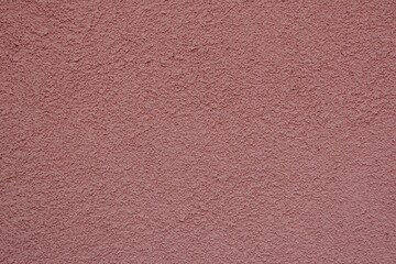 textured concrete wall background. pink gritty surface