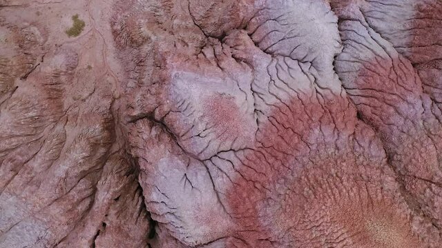 Aerial view of erosion in the red desert landscape with vein patters in Wyoming.