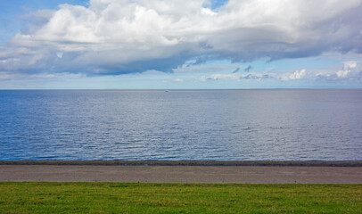 Landscape with dike along the Wadden sea in the Netherlands
