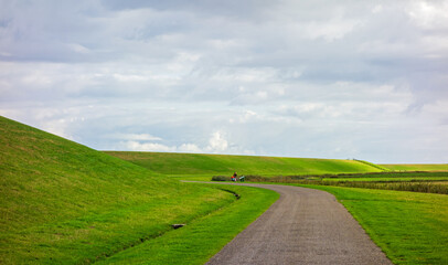 Landscape with dike along the Wadden sea in the Netherlands
