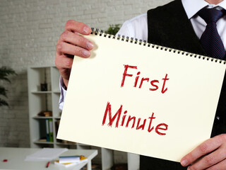 Business concept about First Minute with sign on the sheet.