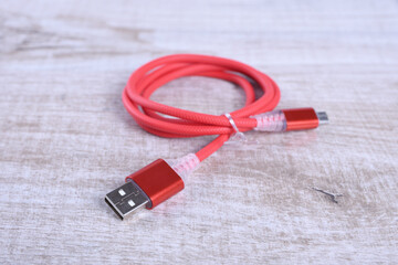 USB electronic wire cable on wooden background